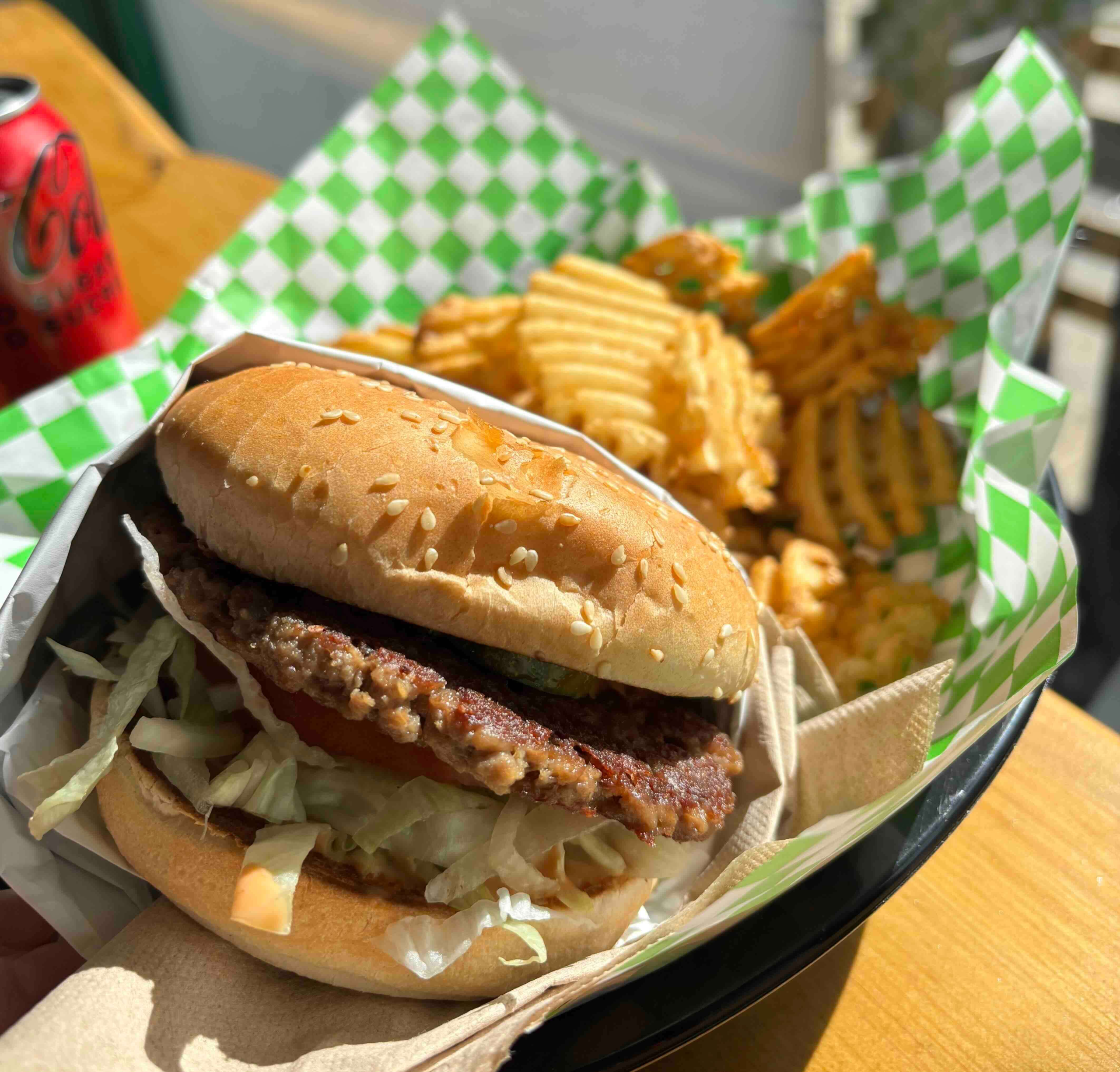 cheeseburger and waffle fries from Soy Boys Toronto